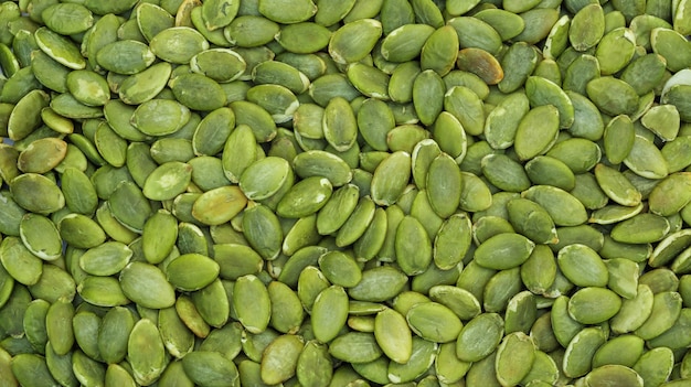 Close up of green pumpkin seeds background