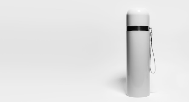 Close-up of grey steel stainless thermos isolated on white with copy space. Black and white photo.