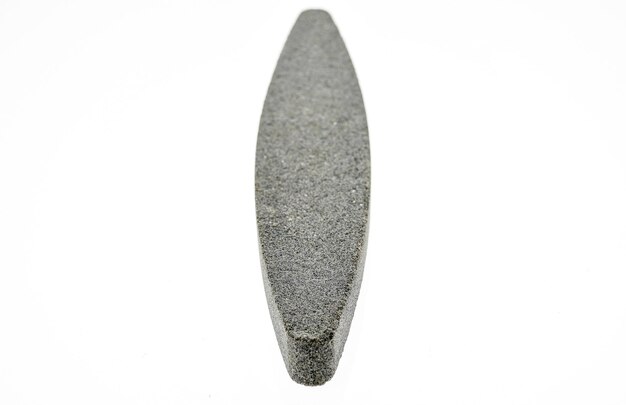 Photo close-up of grindstone over white background