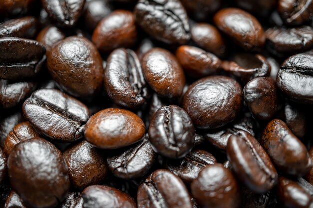 Close up of group black coffee beans. Strong black espresso