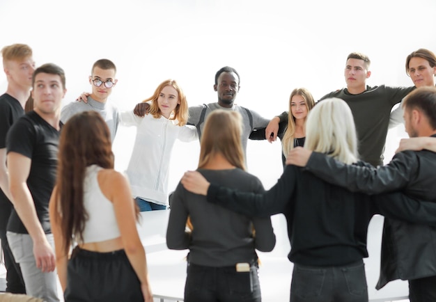 Close up a group of diverse young people standing in a circle