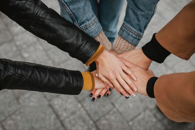 Photo close-up group of girls touching hands