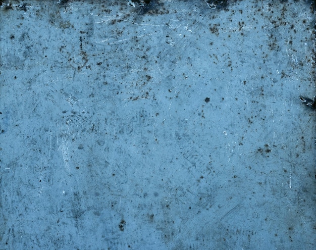 Close up grunge abstract uneven background texture of vintage weathered corroded blue uneven metal surface with rust stains