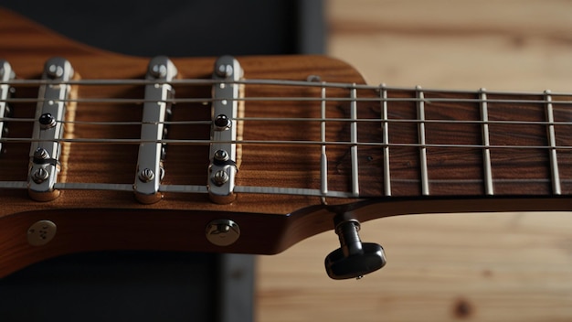 a close up of a guitar with a metal clip on it