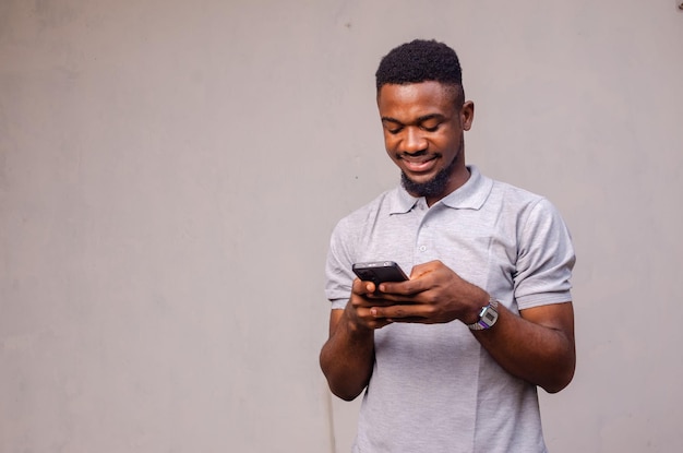 Close up of a guy seriously using his phone