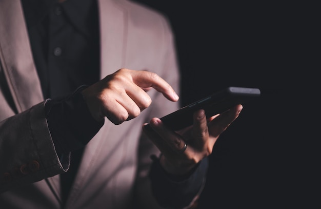 Close up hand of businessman with mobile phone Concept of technoloy for business