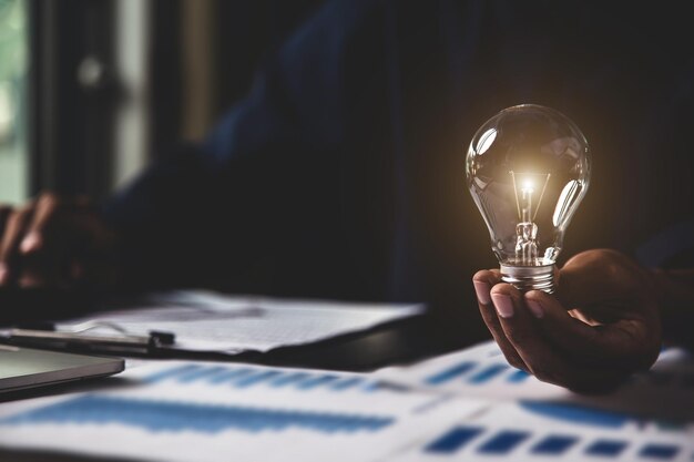 Close up hand choose light bulb or lamp for human resources