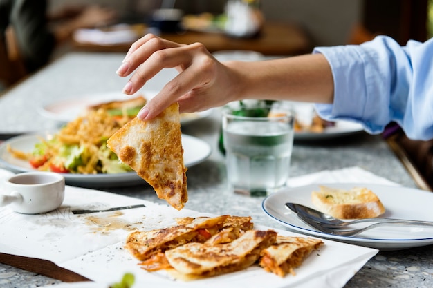 Close up of hand enjoying the food