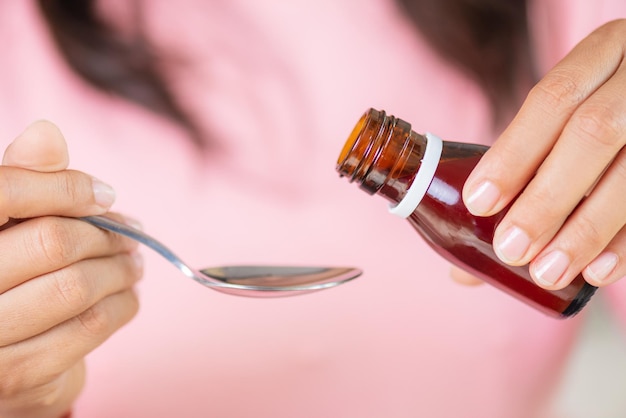 Close-up of hand holding medicine