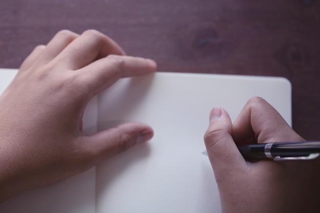 Close up of Hand holding pen, it's like a letter writer