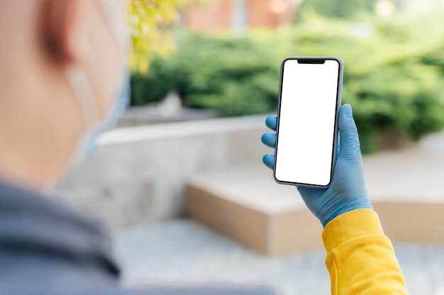 Close-up hand holding smartphone