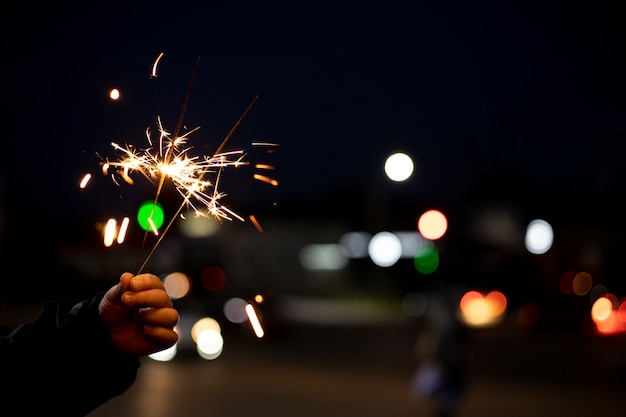 Close up hand holding sparks