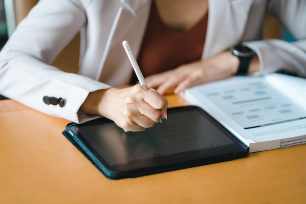 Close up hand man Signature contrac digital tablet in Office Indoors