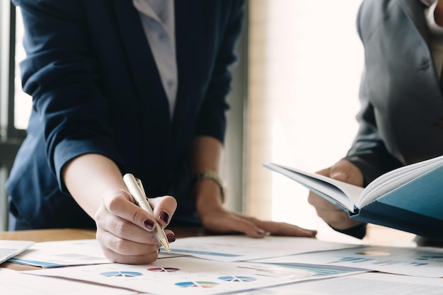 close up hand of marketing manager employee pointing at business document during discussion at