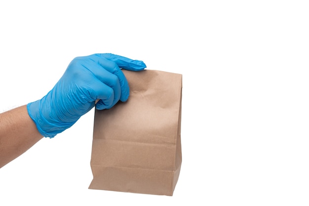 Close up hand in medical glove and holding food paper bag