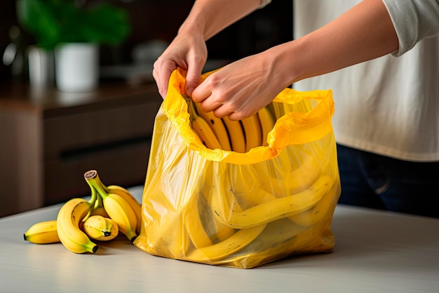 close up of hand putting banana peel into rubbish bag at home