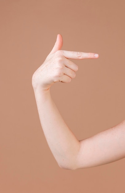 Close up of a hand teaching sign language