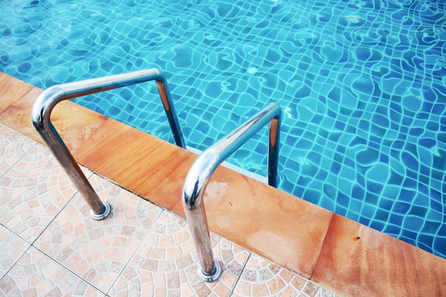 Close up handle beside of swimming pool in the hotel. 