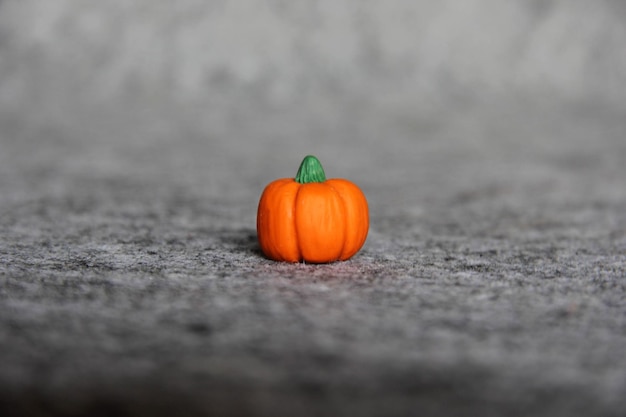 Close up handmade polymer clay miniature of pumpkin