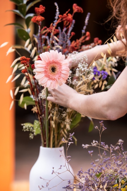 Close up hands holding flower