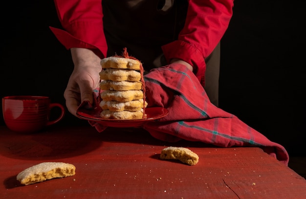 Close up hands holding homemade cookies