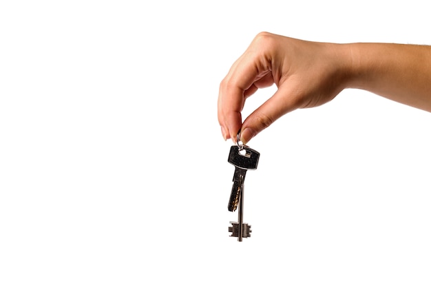 Close up on hands holding a key chain isolated