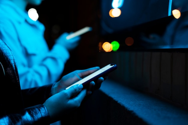 Close up hands holding smartphone