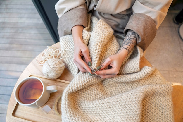 Close up hands knitting at home