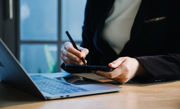 Close up hands multitasking man using tablet laptop and cellphone connecting wifi