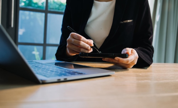 Close up hands multitasking man using tablet laptop and cellphone connecting wifi