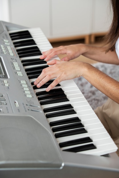 Close up hands playing the piano