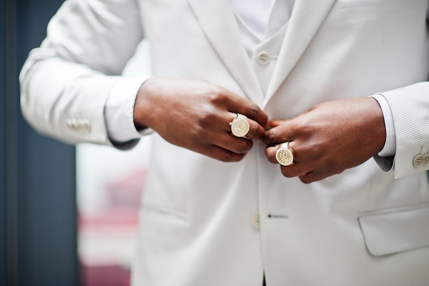 Close up hands with rings of handsome african american gentleman in formalwear