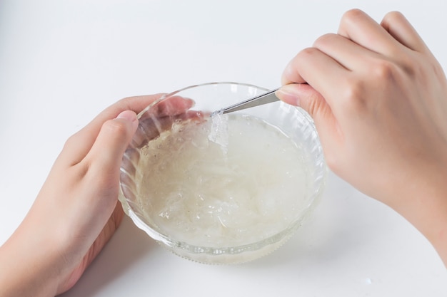 Close-up of hands with a white ingredient