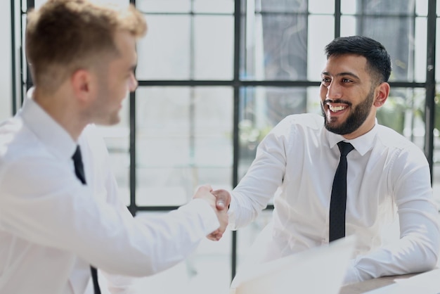 Close up of handshake in the modern office