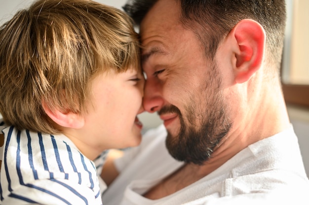 Close-up happy father and son