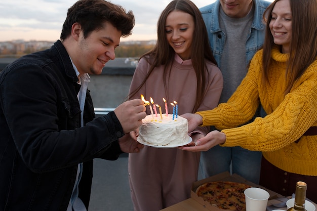 Close up happy friends with cake