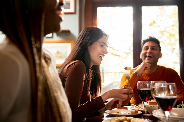 Close up happy people dining out