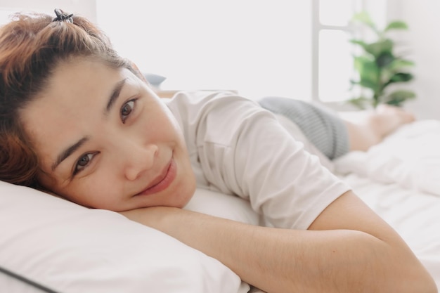 Close up of happy woman just wake up in warm morning of summer