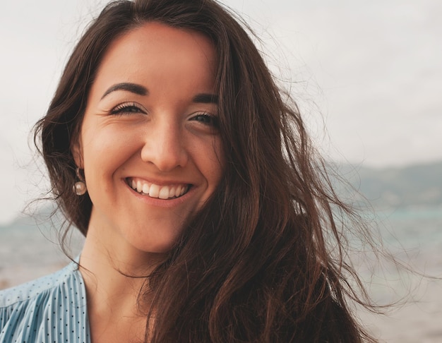 Close up Happy woman near ocean summer vacation