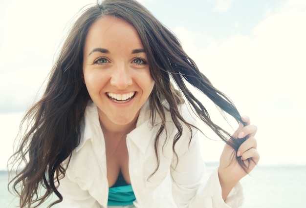 Close up Happy woman near ocean