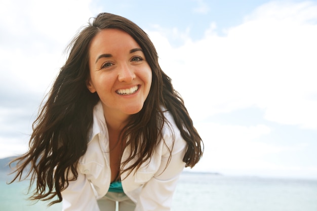 Close up Happy woman near ocean