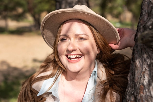 Close up happy woman with hat