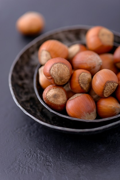 Close-up hazelnuts in metal plate