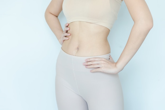 Close up of healthy woman show slim body