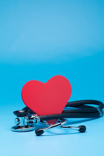 Close-up of heart shape on table against blue background