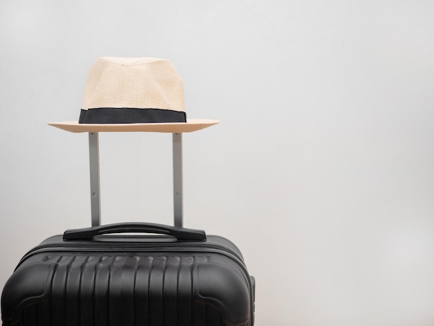 Close up holiday hat above luggage isolated