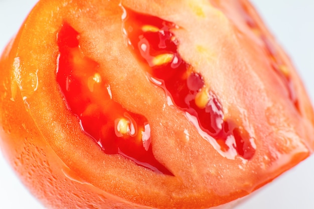 Close up home grown tomatoes on the plate. Ecologically friendly vegetables from personal garden. Half of tomato inside macro view.