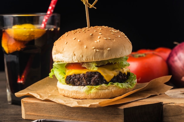 Close up of a homemade delicious beef hamburger on a wooden table.