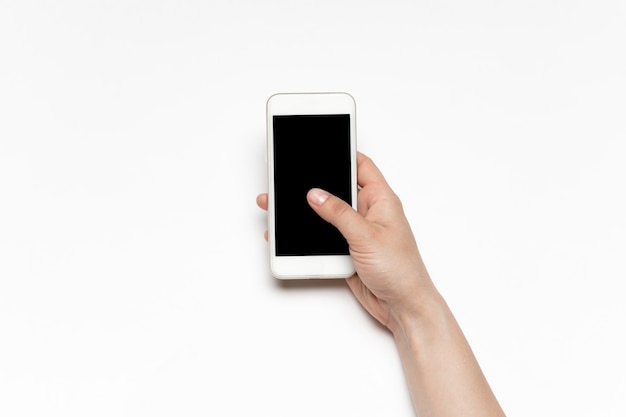 Close up of human hand using smartphone with blank black screen