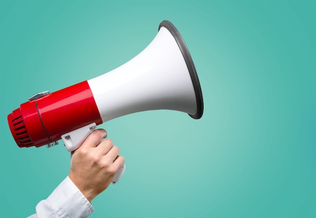 Close-up Human Hand with Megaphone on  background